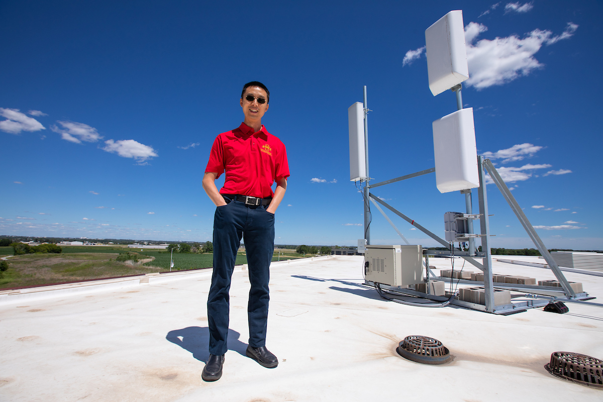 Hongwei Zhang with some of the hardware that powers CyNet, an advanced wireless network system and a forerunner of the ARA project.