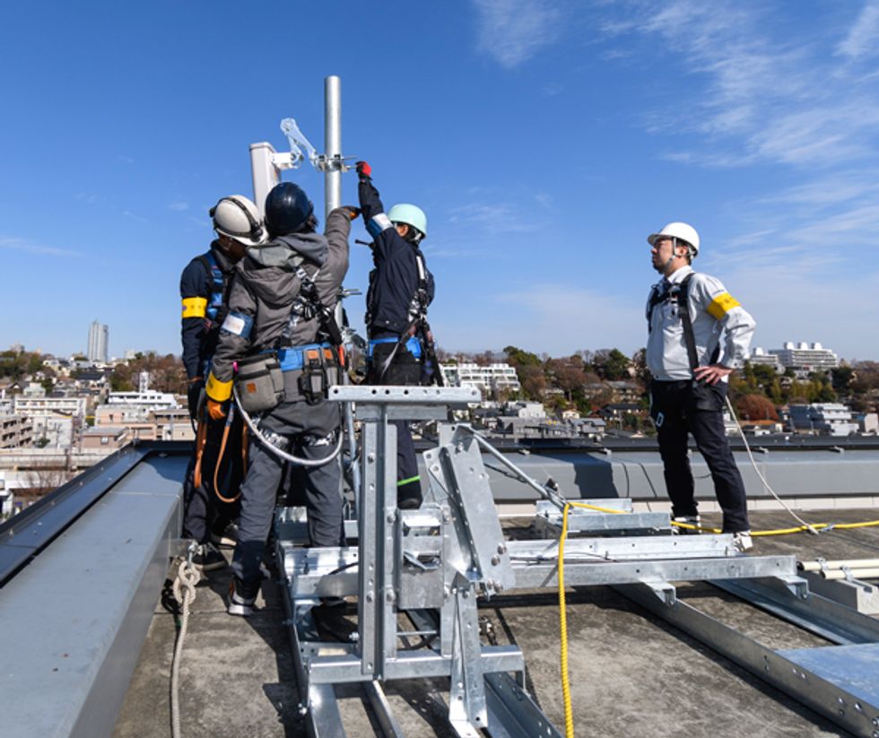 Image of workers on a rooftop.